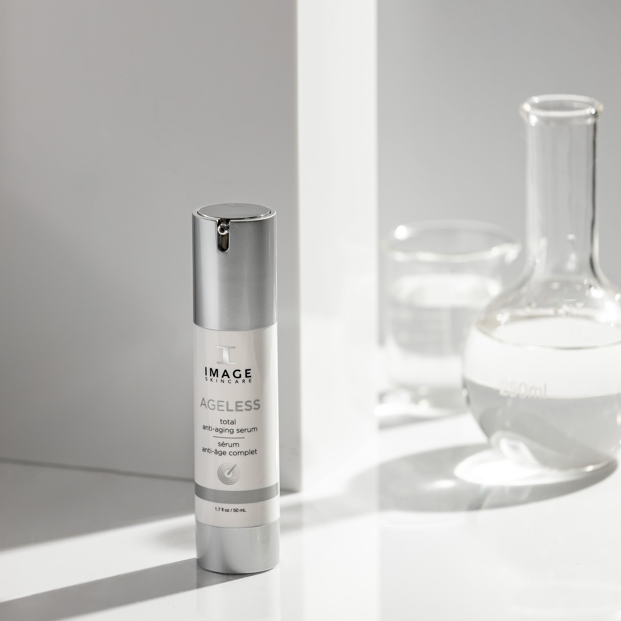 Skincare serum bottle labeled 'IMAGE' on a white surface with a gray background