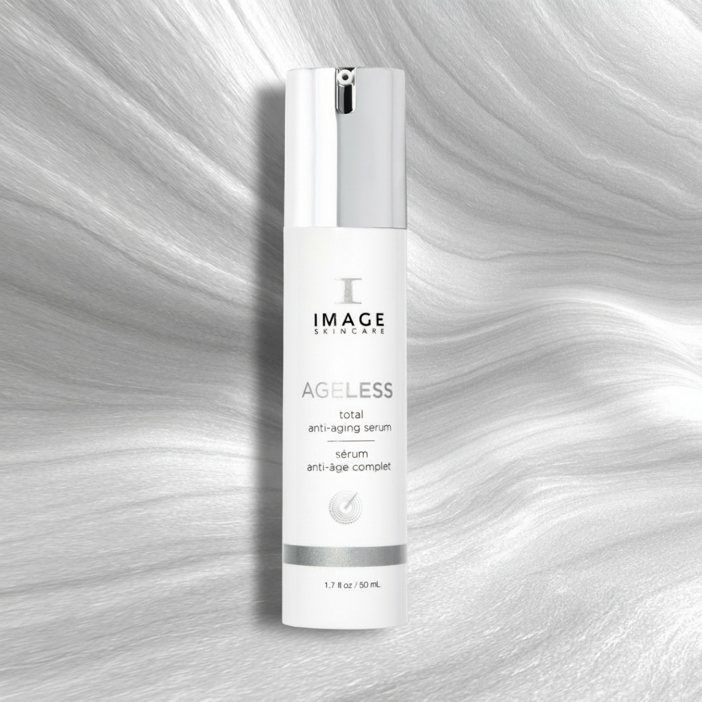 Skincare serum bottle labeled 'IMAGE Skincare Ageless' on a textured gray background