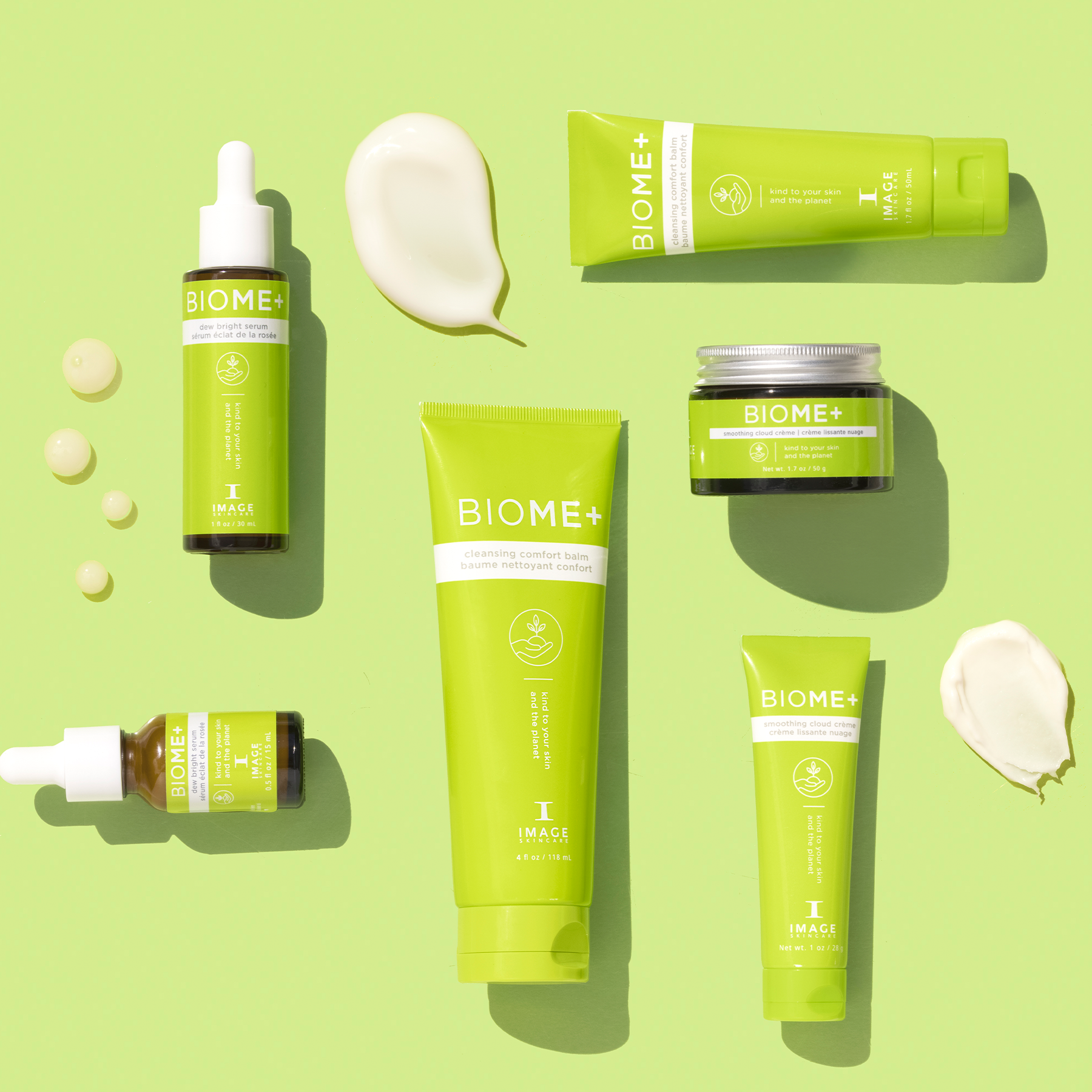 Collection of BIOME+ skincare products on a green background