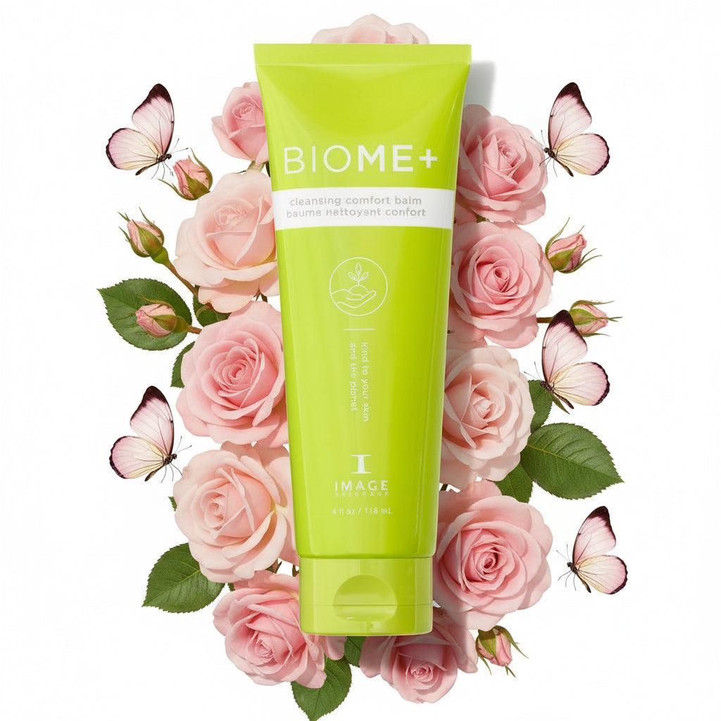 A green tube of BIOME+ Cleansing Comfort Balm by IMAGE Skincare, designed for removing makeup and hydrating the skin.
