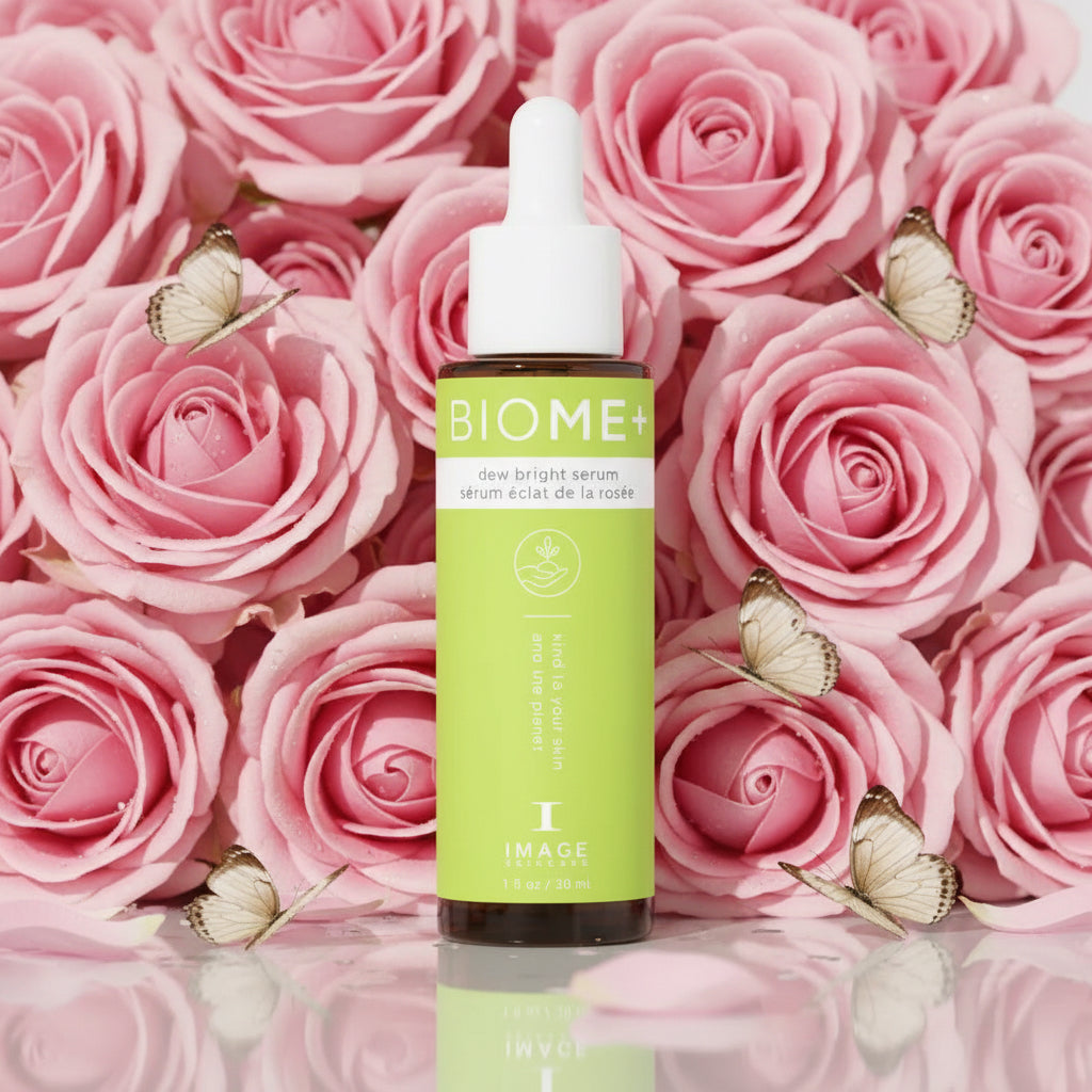 A bottle of BIOME+ skin bright serum with a dropper, placed against a light green background.