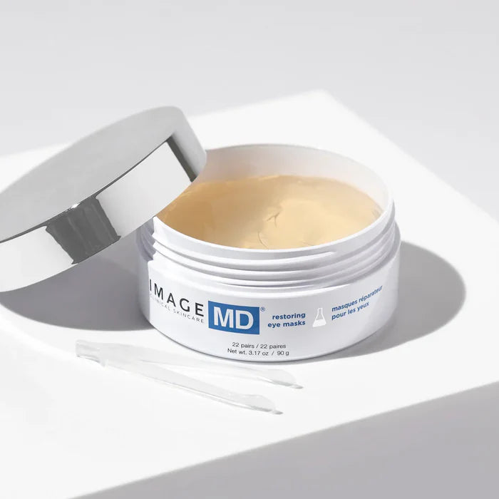 Open jar of IMAGE MD eye masks on a light background
