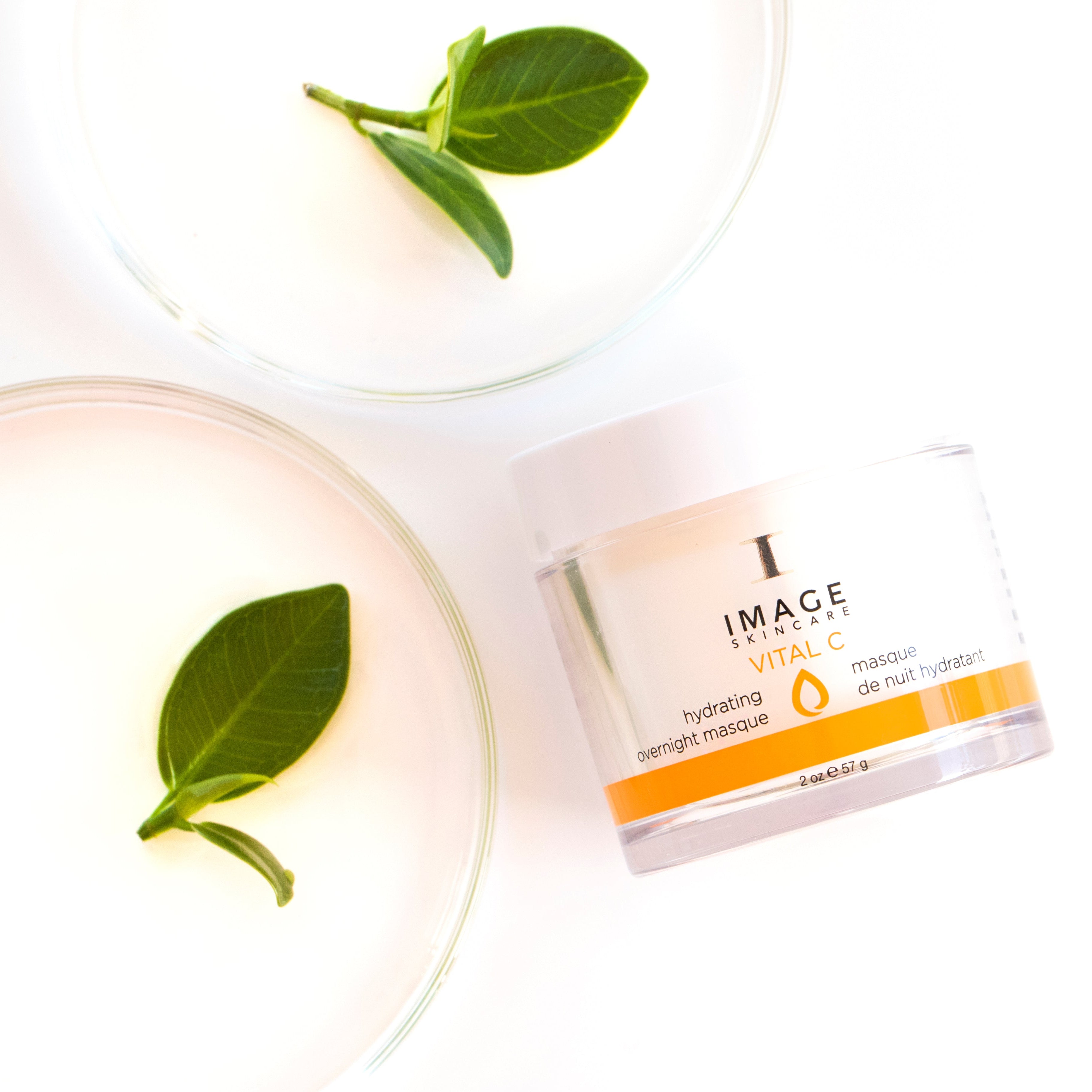 Product packaging with green leaves on a white background