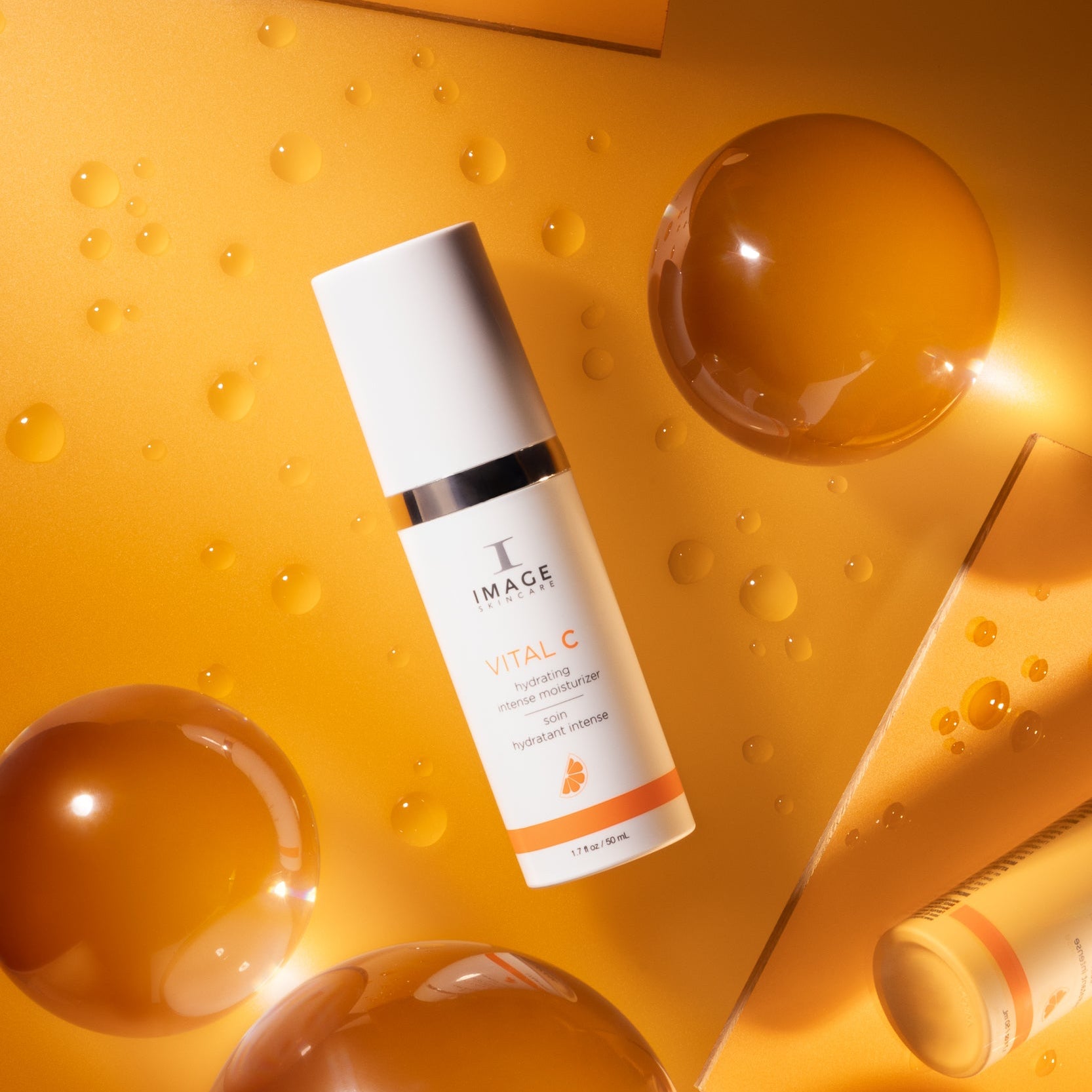 Skincare bottle with dropper on a textured yellow background
