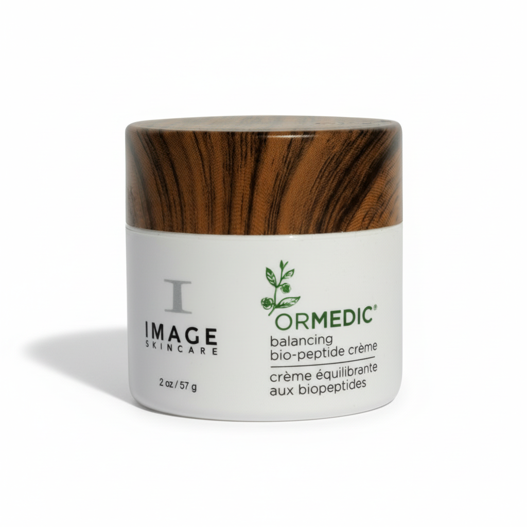 A jar of IMAGE Skincare ORMEDIC Balancing Bio Peptide Creme with a white label and green accents on a plain background.