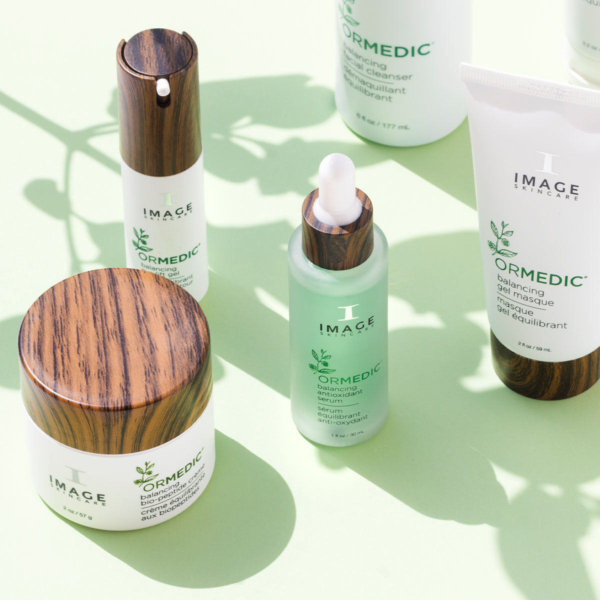 Collection of IMAGE Skincare products on a light green background