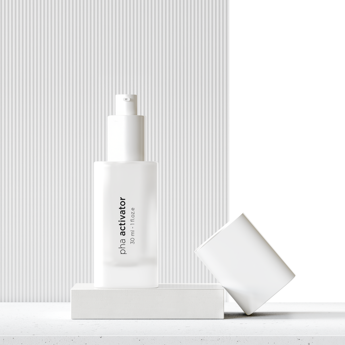 A frosted white skincare pump bottle labeled 'pha activator' stands on a white pedestal, with its matching cap resting beside it on a light stone surface against a white ribbed background.