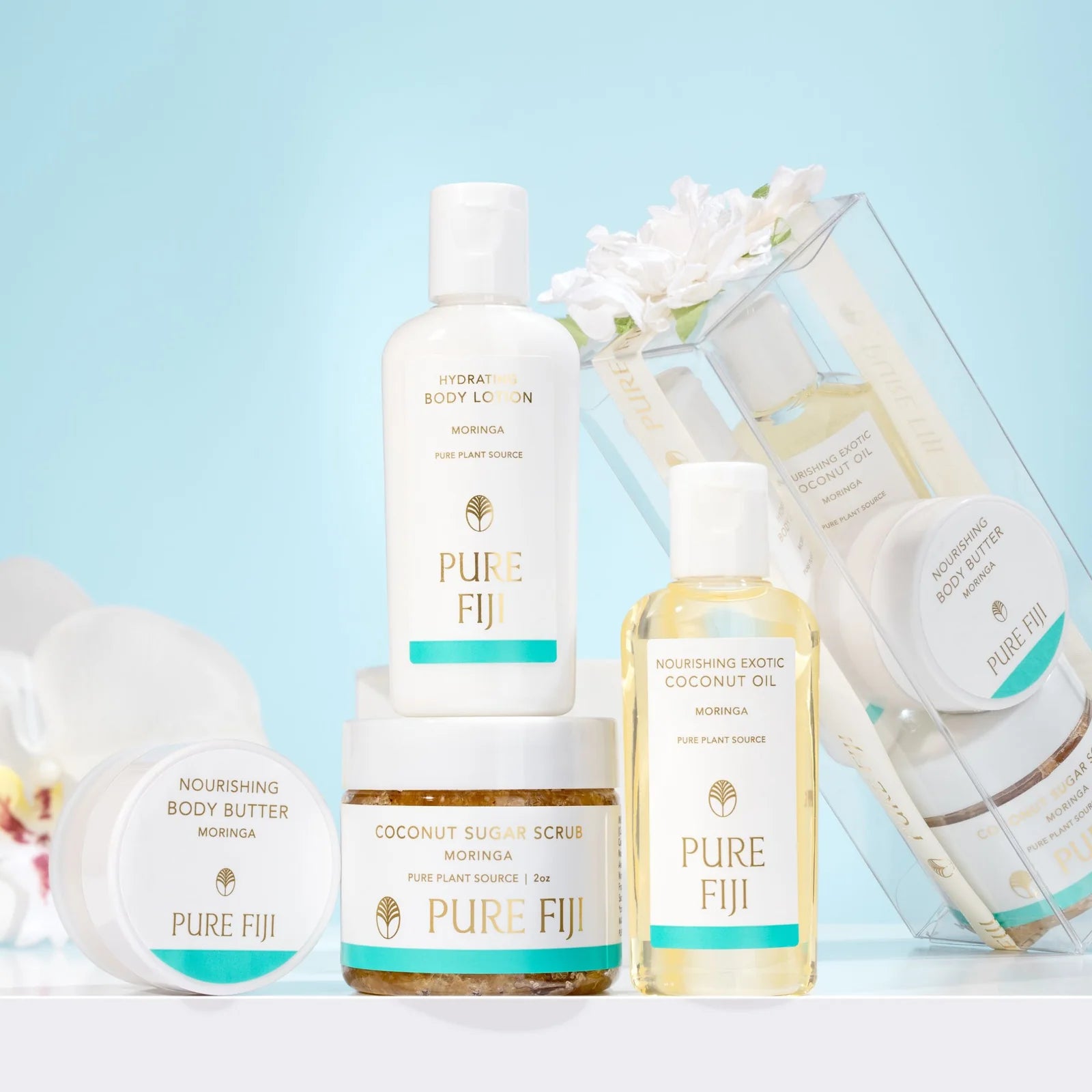 Collection of Pure Fiji skincare products on a light blue background