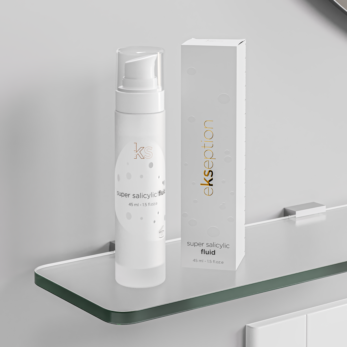 A white cosmetic pump bottle labeled 'ekseption super salicylic Bal' stands next to its matching white box with gold 'ekseption' branding on a glass shelf against a light gray wall.