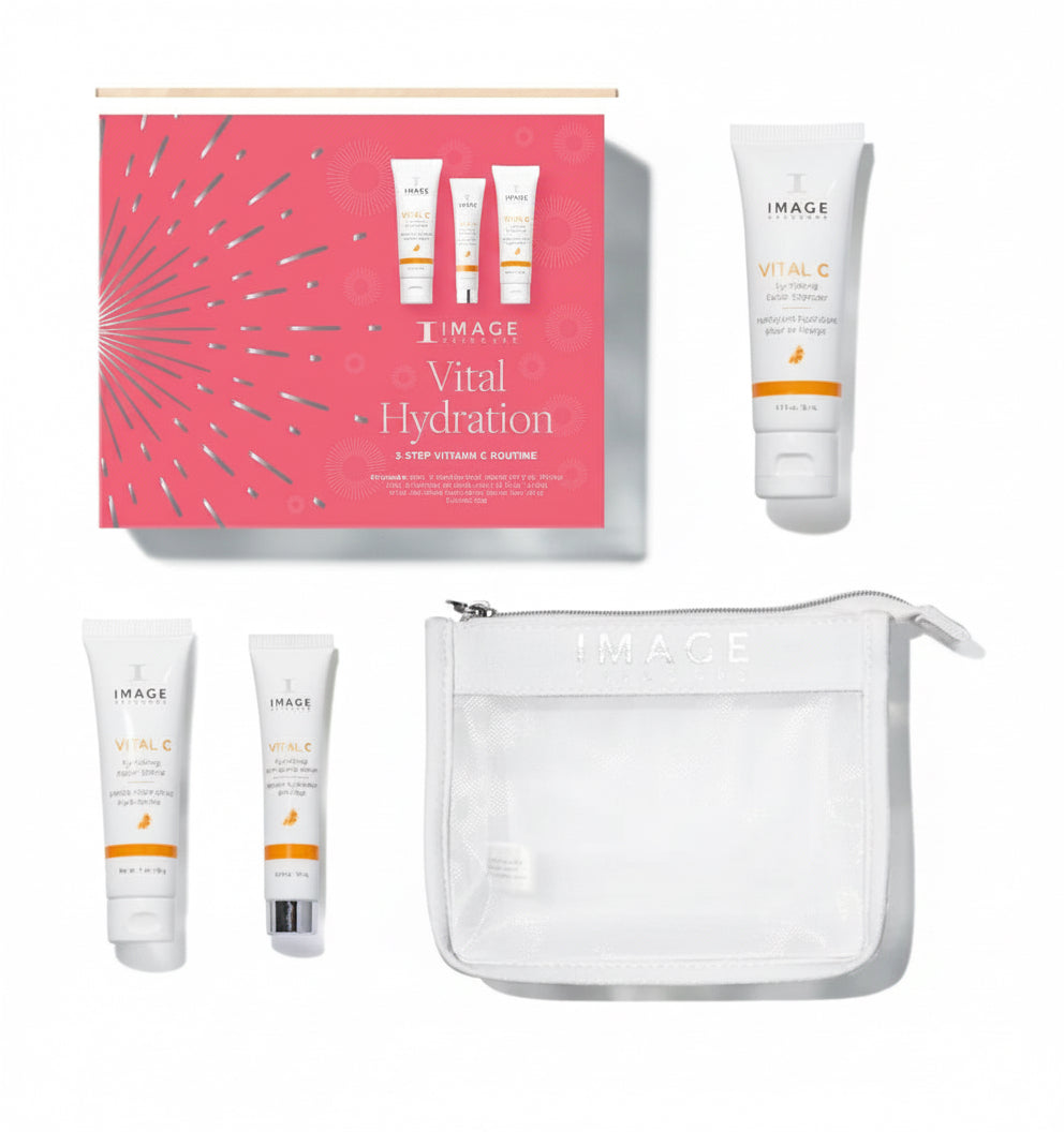 A collection of skincare products from IMAGE Skincare, including a hydrating facial cleanser, anti-aging serum, and repair crème, presented with a vibrant pink box and a clear cosmetic bag.