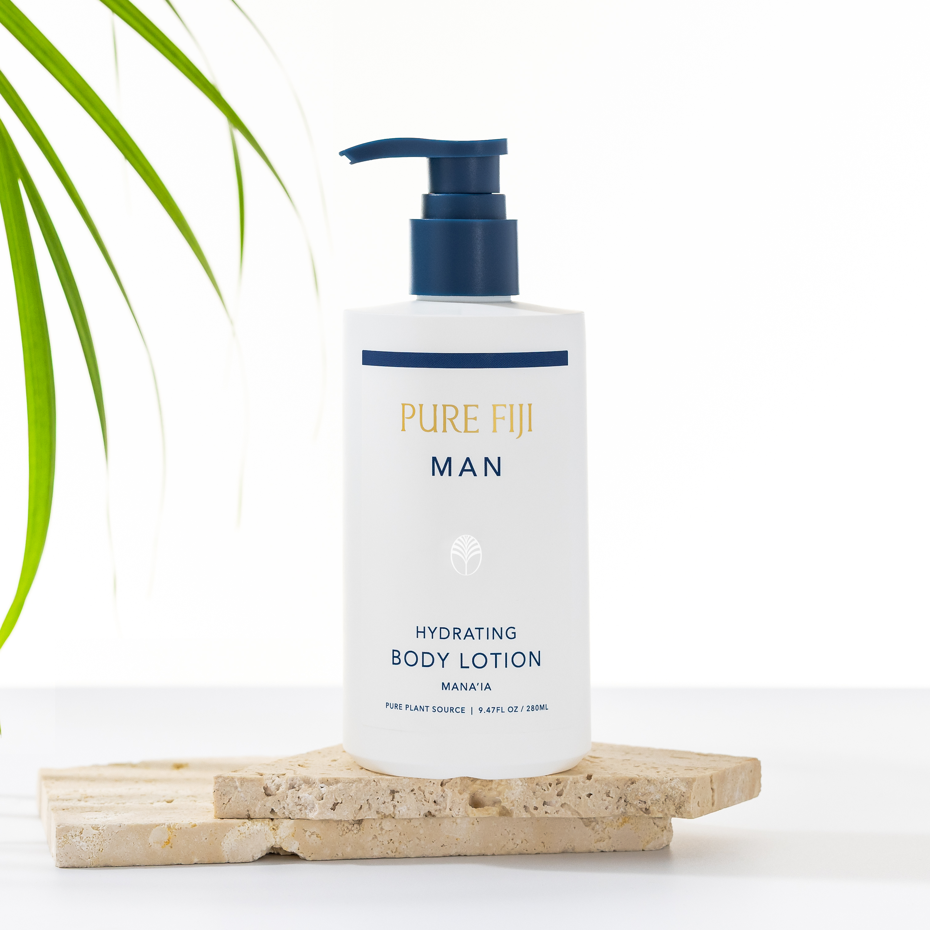 Pure Fiji Man hydrating body lotion on a wooden block with a plant in the background