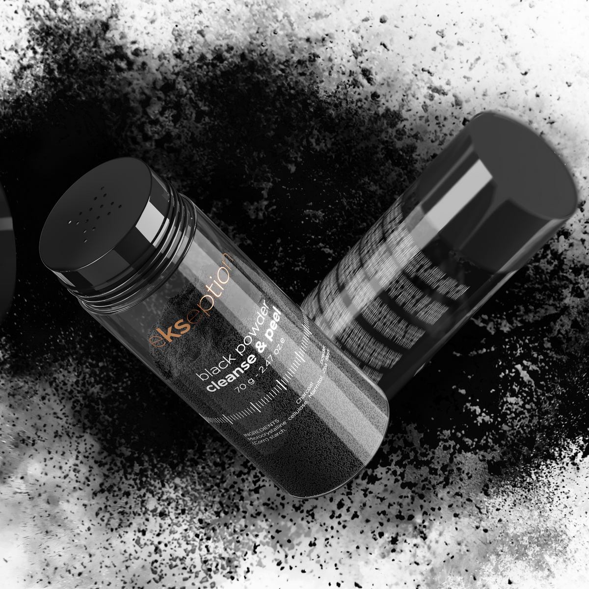 Two black cosmetic stick containers with their caps off, lying on a white background with scattered black powder around them. One container shows the brand name 'Ekseption' in orange text.