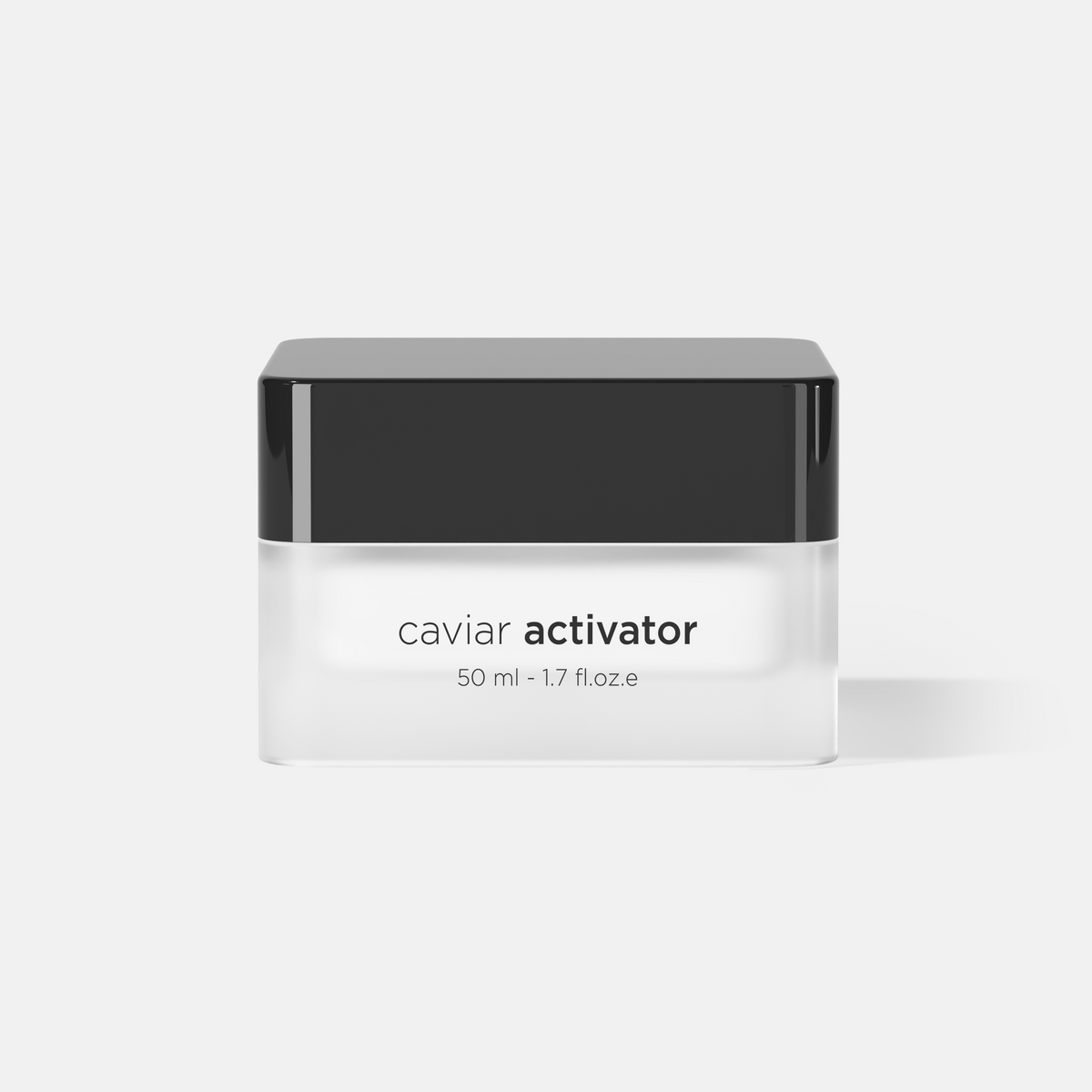 A 50 ml jar of caviar activator cosmetic cream, featuring a minimalist design with a glossy black lid and a frosted white glass container, set against a clean light gray background.