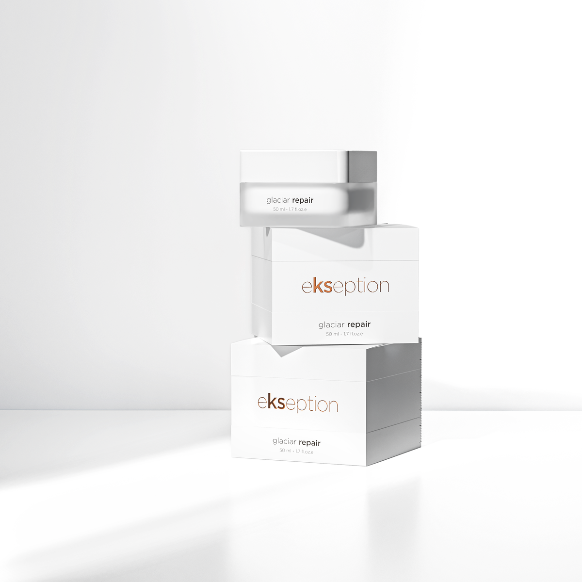 Three stacked white skincare product boxes labeled 'ekseption glacier repair' on a clean white studio background with soft shadows.