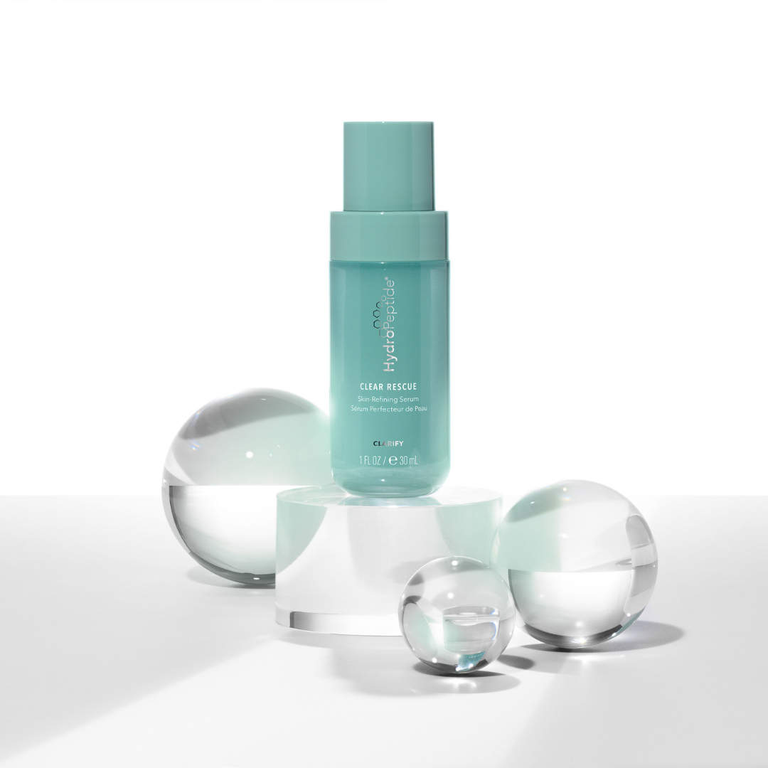 Clear Rescue Serum bottle with transparent spheres on a white background
