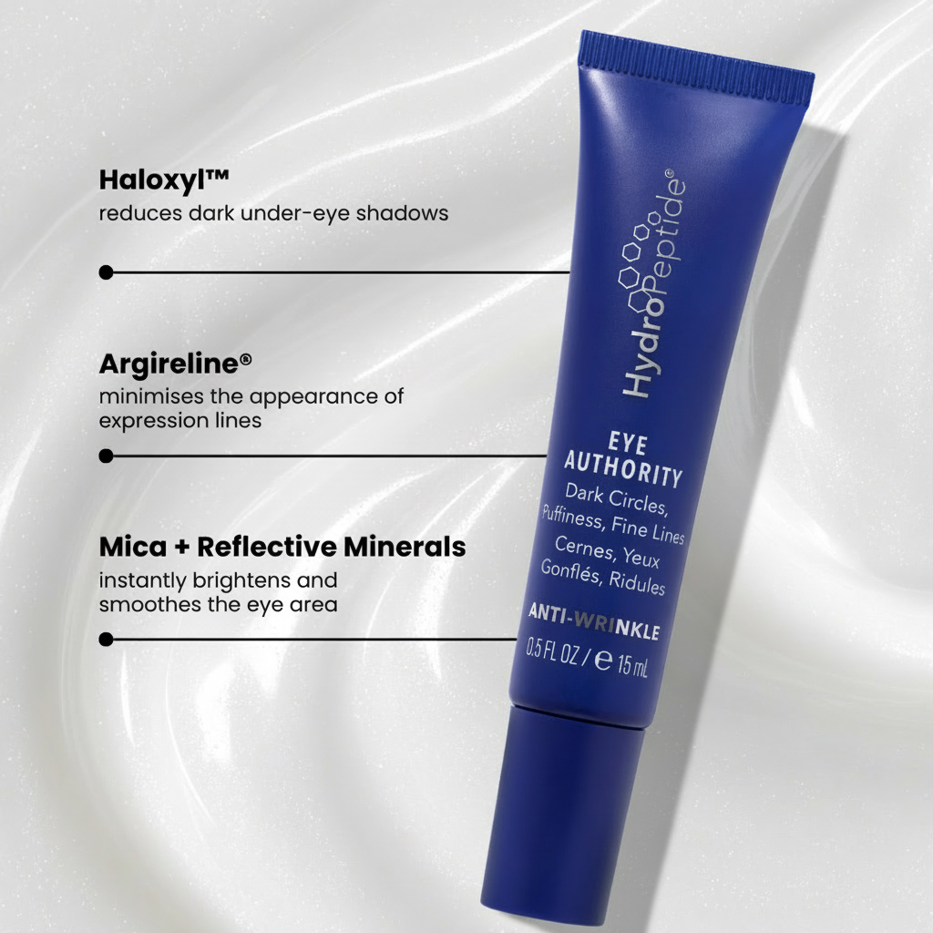 Blue eye cream tube labeled 'Eye Authority' with text on benefits on a light gray background