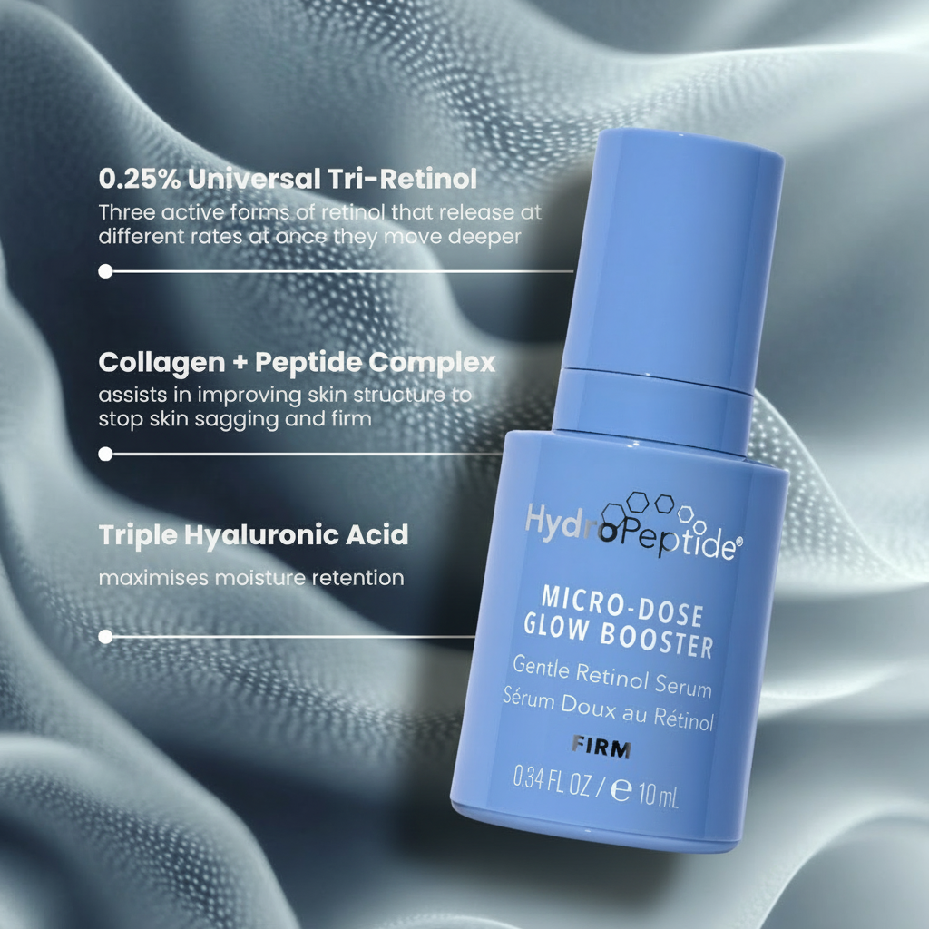 Blue Micro-Dose Glow Booster serum bottle with text detailing ingredients on a textured gray background