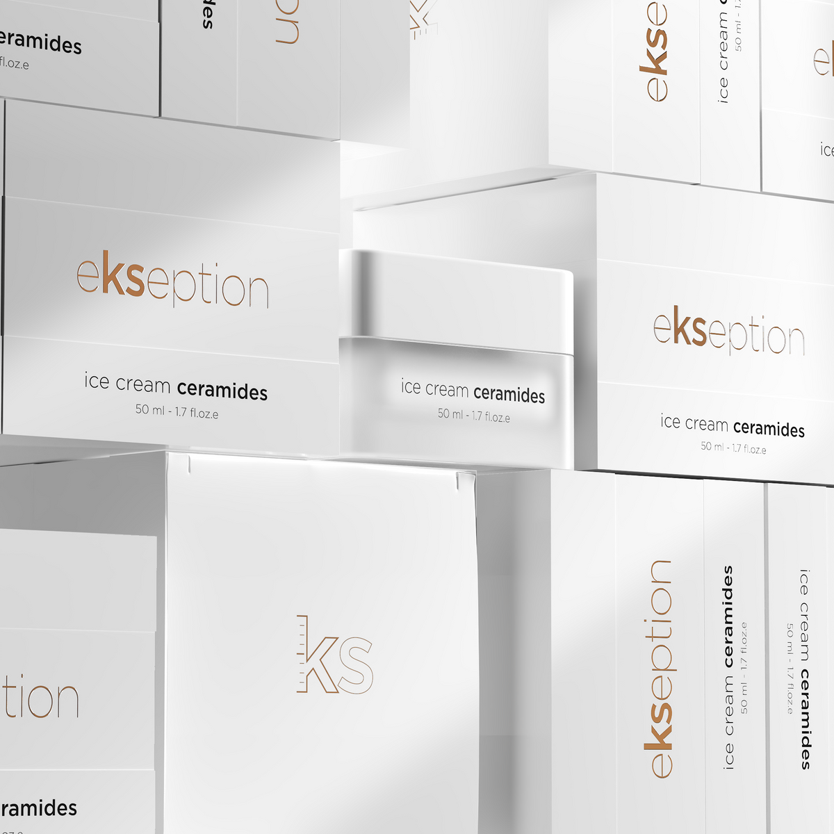 White Ekseption skincare packaging featuring stacked boxes and a jar of ice cream ceramides, with clean minimalist branding and text.