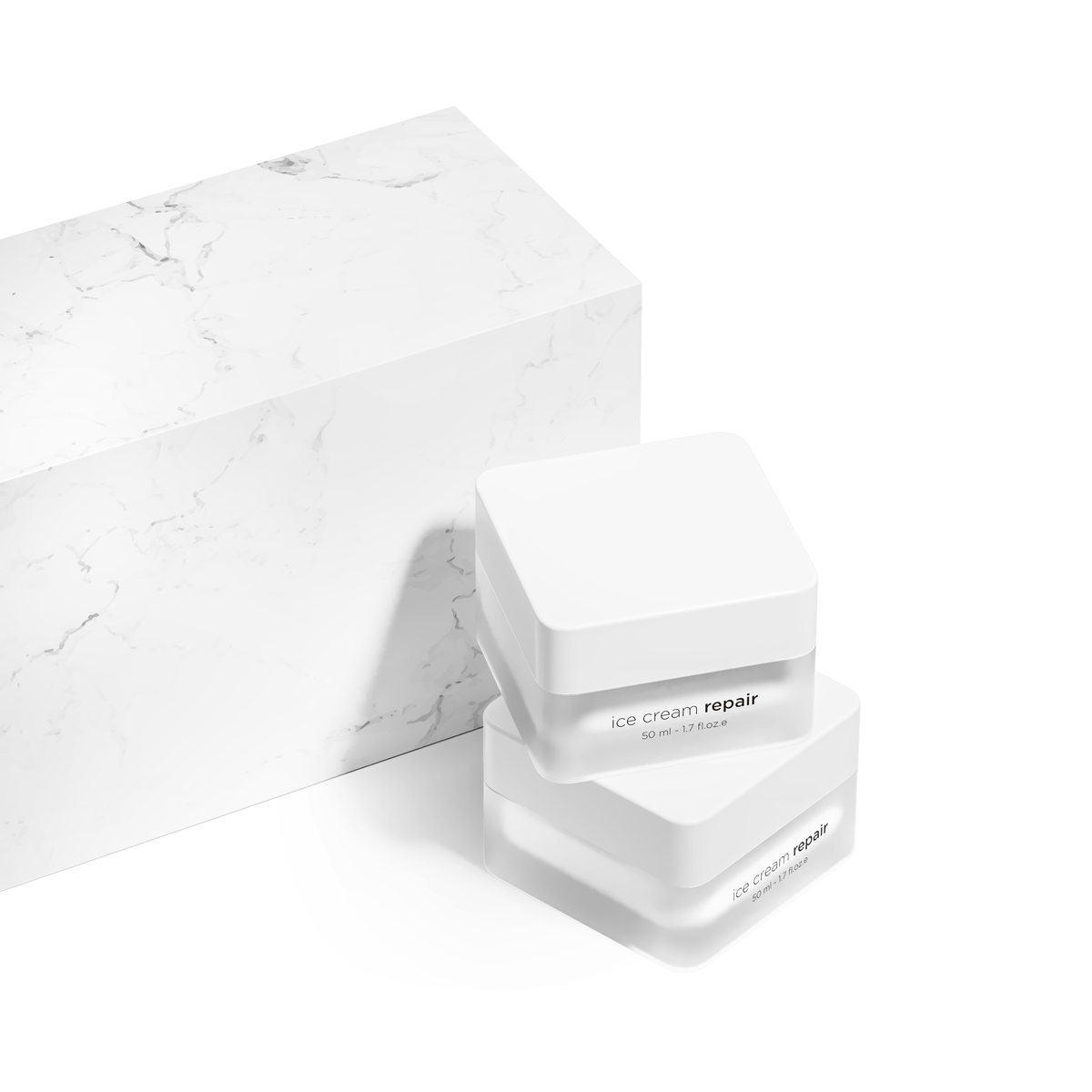 Two stacked white cosmetic jars labeled 'ice cream repair' with a matching white marble-textured box on a clean white background.