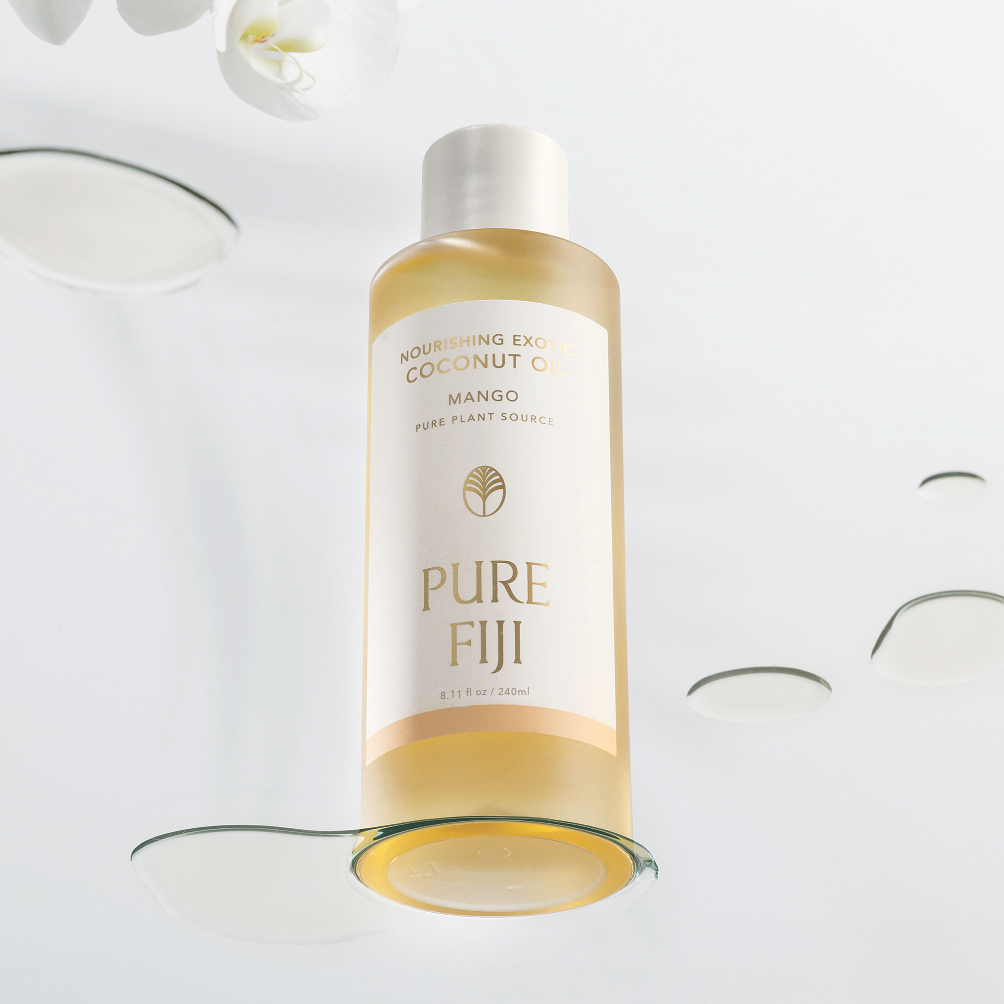 Bottle of Pure Fiji coconut oil on a white background with decorative elements.